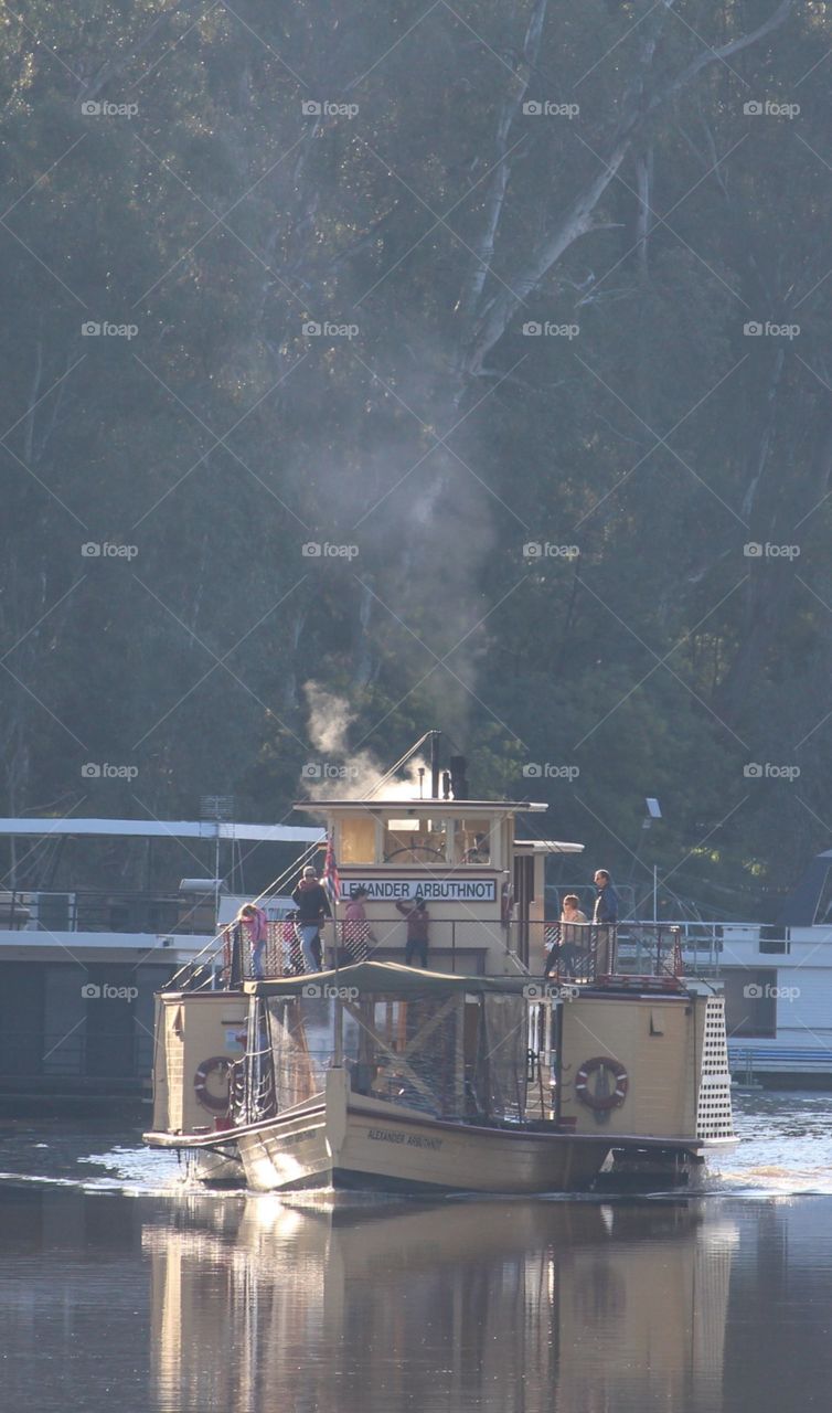 Tourists spending a tranquil afternoon on a paddlesteamer