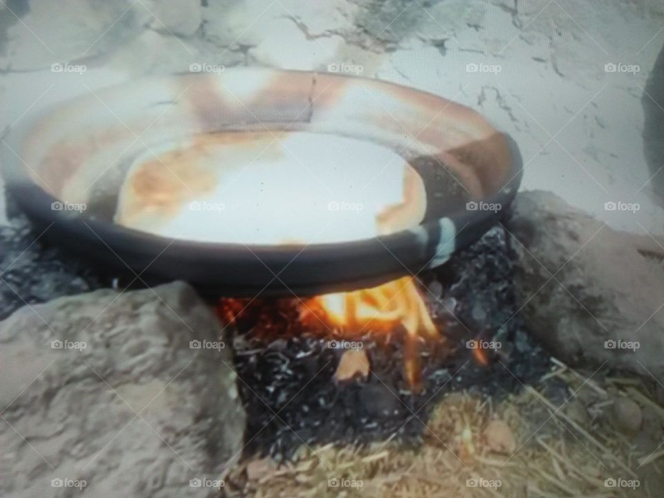  Preparation of  Moroccan bread over the oven.