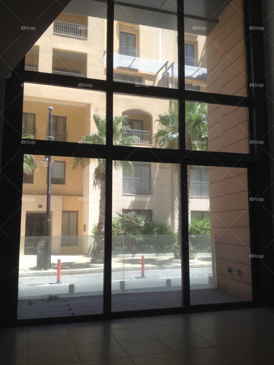 Windows around the World. Looking out of a contemporary Duplex double height window, in Portomaso, Malta.