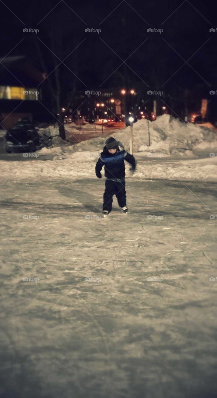 Boy starting to skate on ice
