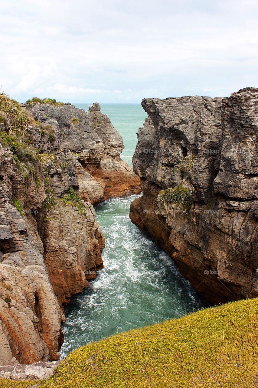 View of sea and rock formation against sky