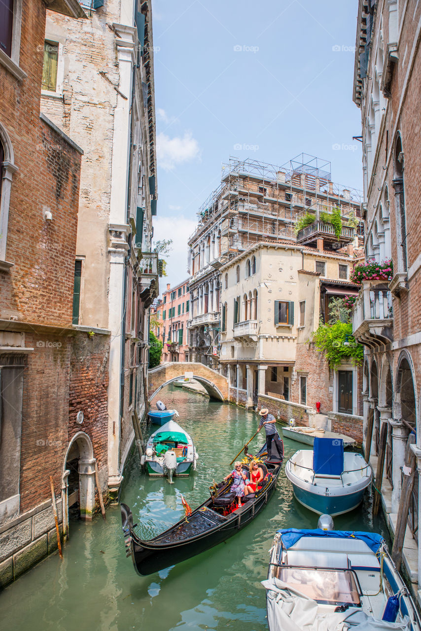 Small bridge in venice and boats