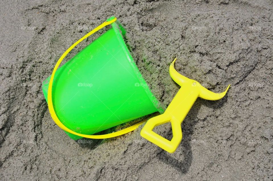 Summer concept. Childs Beach bucket and sand shovel.