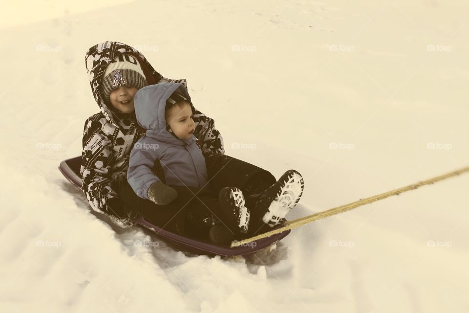 Daddy pulling you in the sled through the snow, so you don’t have to walk 