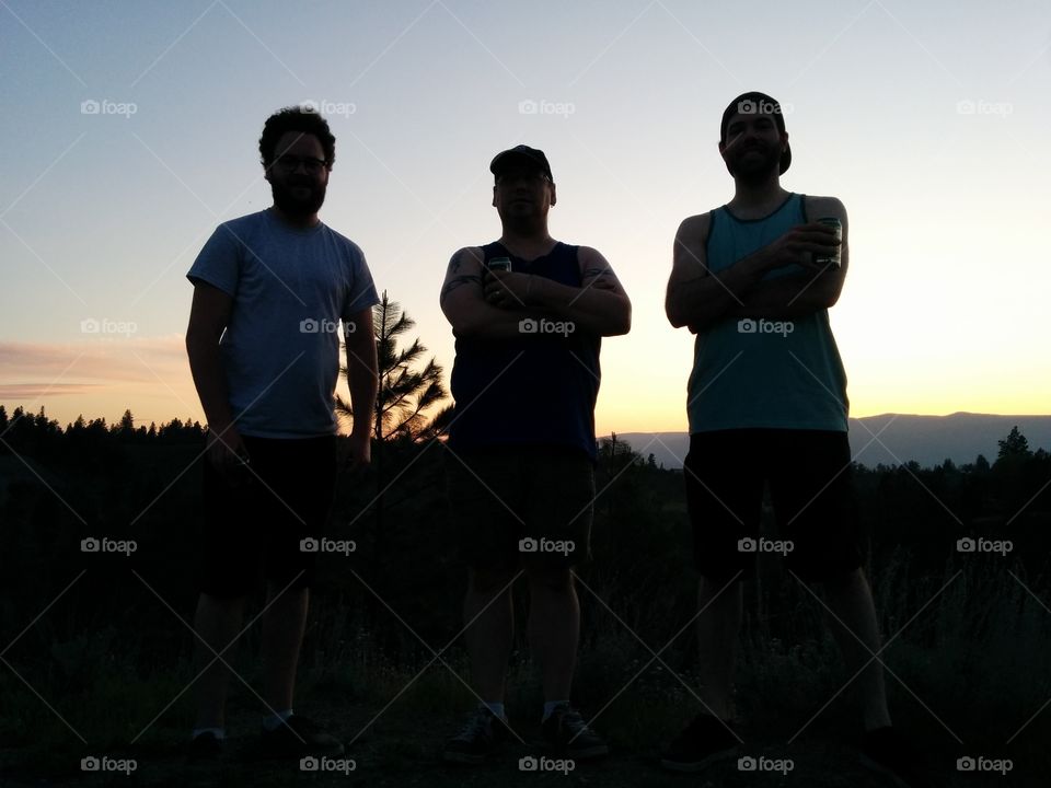 Silhouette of three friends.