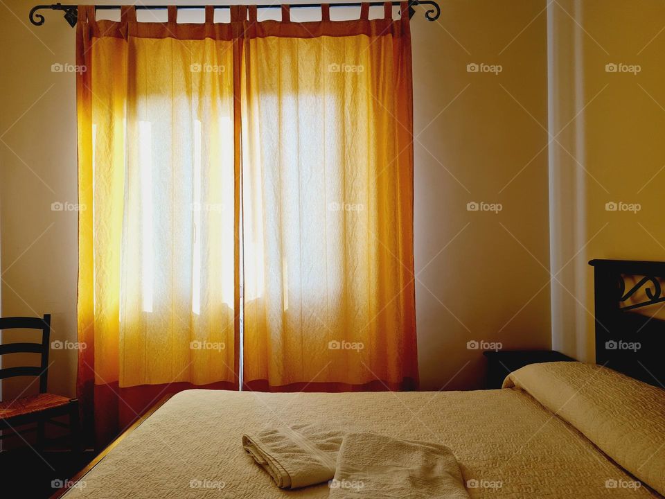 hotel bedroom detail with lights and shadows