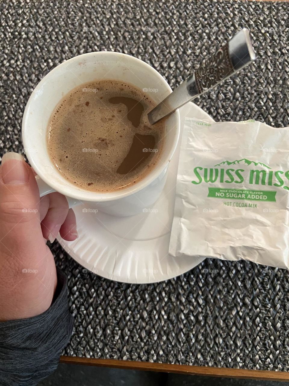 A mug of coffee mixed with Swiss Miss hot chocolate and a little milk. This is my own version of a coffee shop Mocha, but I use sugar free cocoa powder mix and skim milk to keep calories down. It is every bit as delicious though.