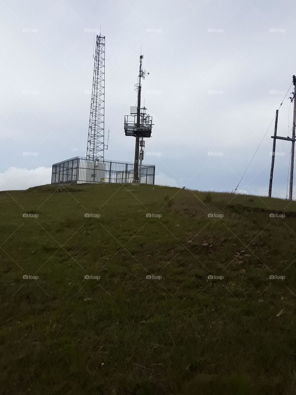 A signals aerial view from the distance with cloudy skies at summertime.