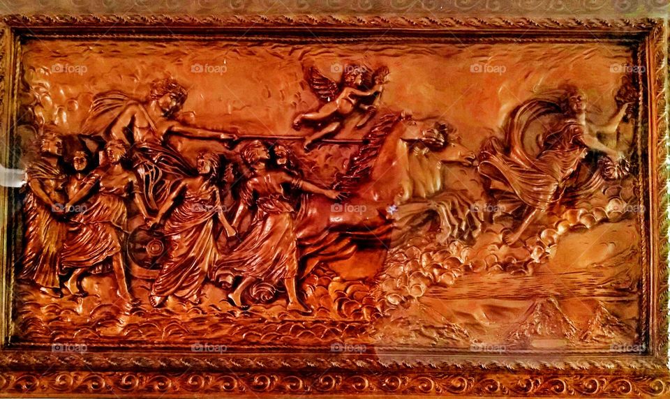 A hand crafted wood carving art design wall frame.