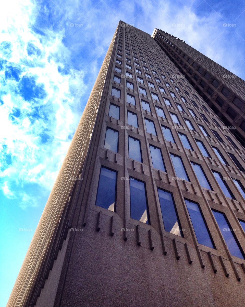 Sky scraper1. Taken from street level looking up against the clouds.