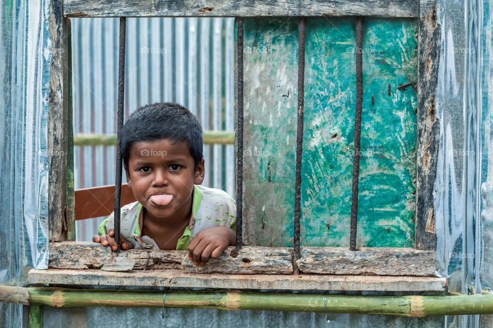 A rural boy sneaking throughout his window