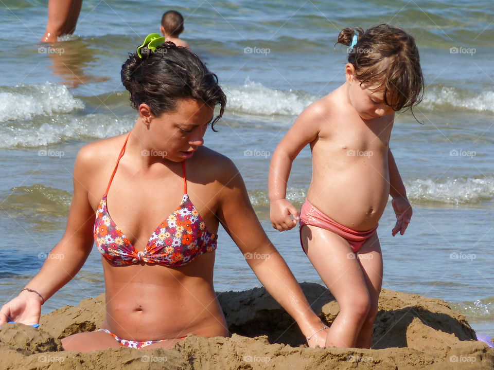 Mother and daughter . Family on the beach 
