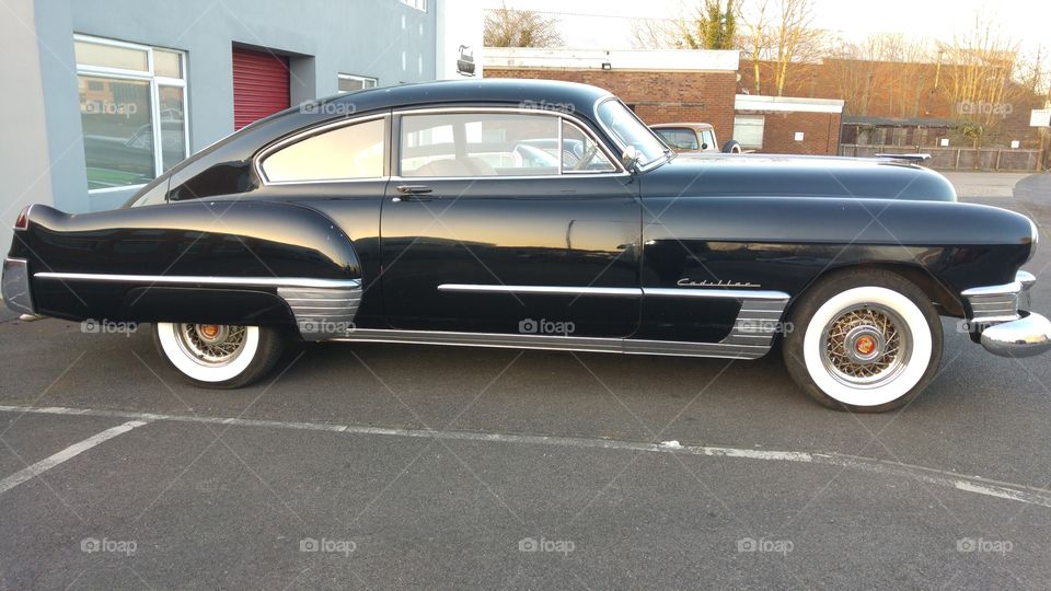 Vintage black porsche on street