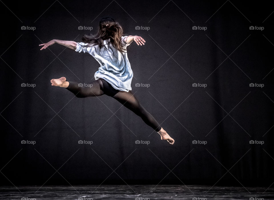 Woman Ballet Dancer Jumping In The Air

