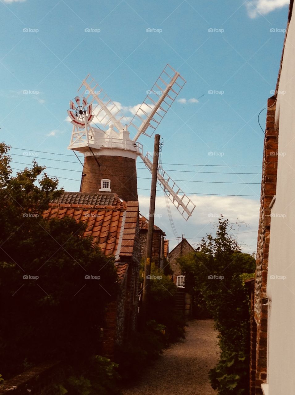 Old English windmill with sails for making flour in Norfolk, England 