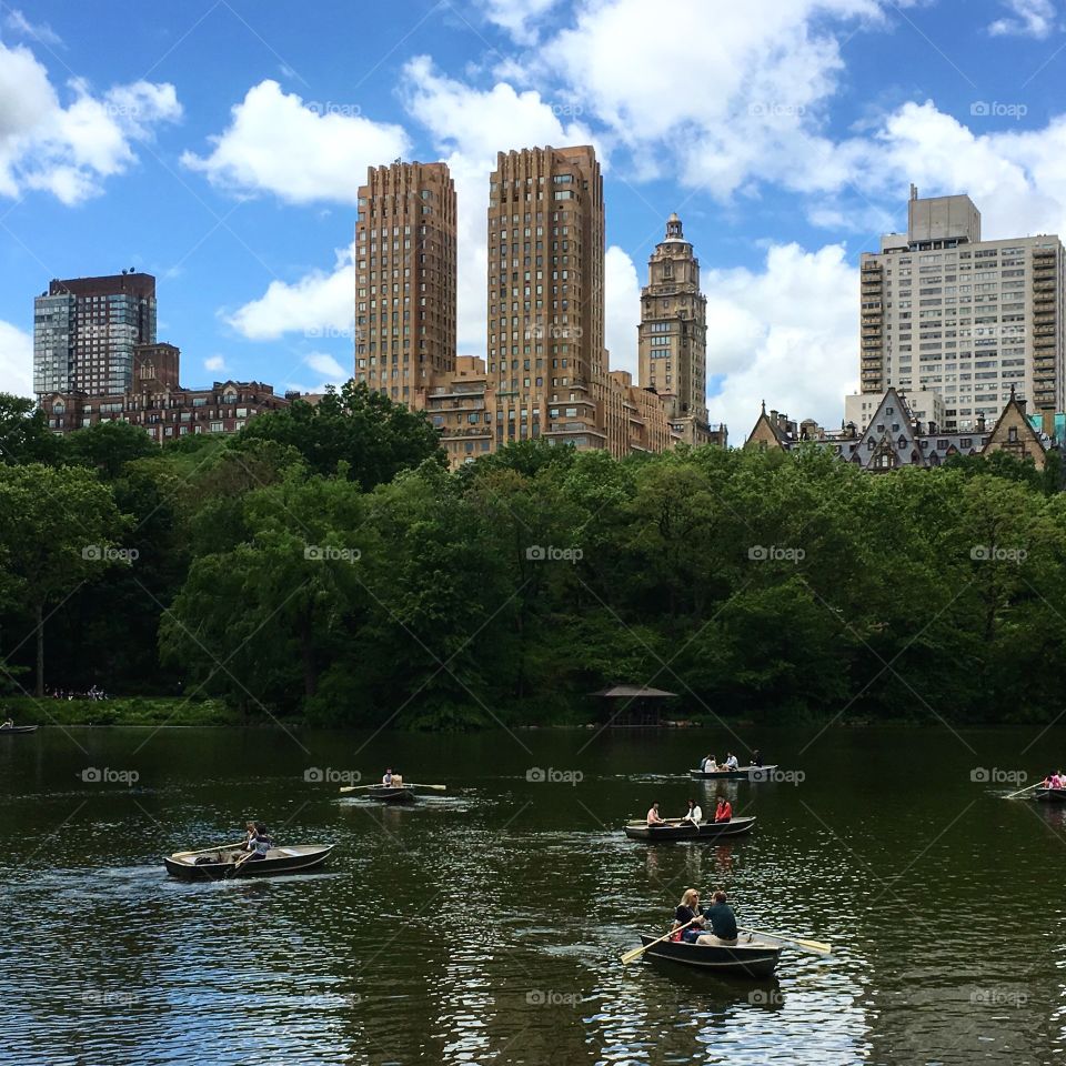 Boats in Central Park with New York Buildings