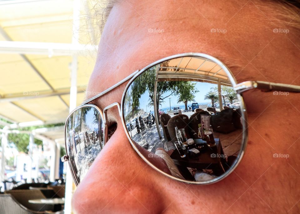 Vacation reflection. Mirroring sunglasses on vacation