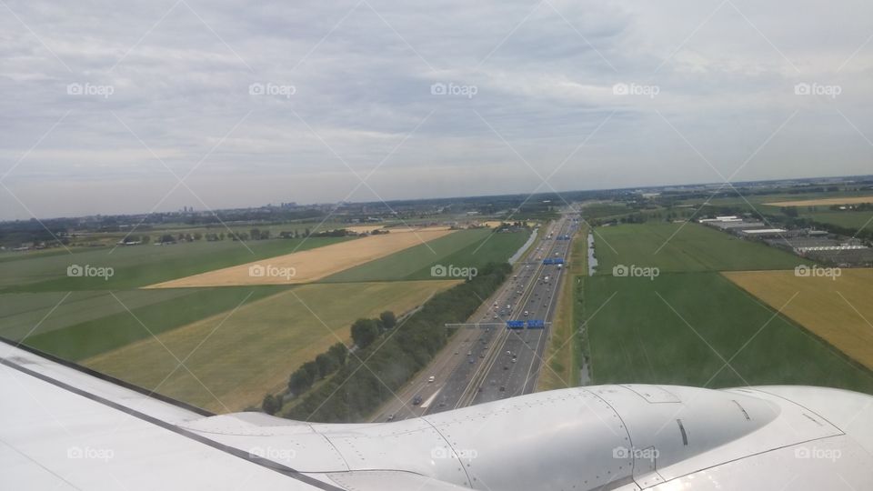 Landing in Amsterdam. KLM flight from Heathrow landing in Amsterdam.