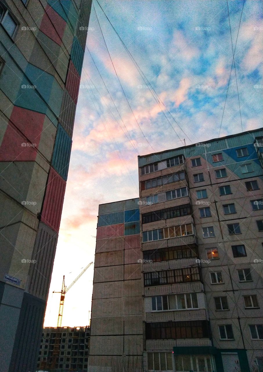 pink clouds. architecture. building. spring.