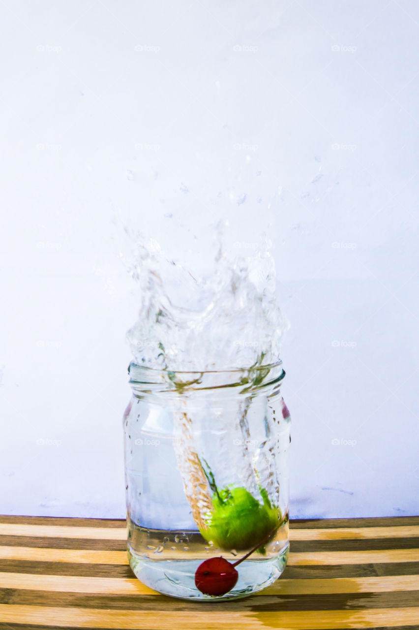 Splash of water in a transparent jar.