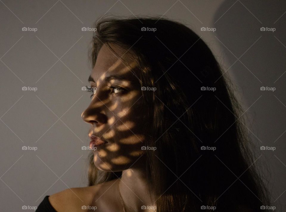 Portrait of young woman with shadow reflection 