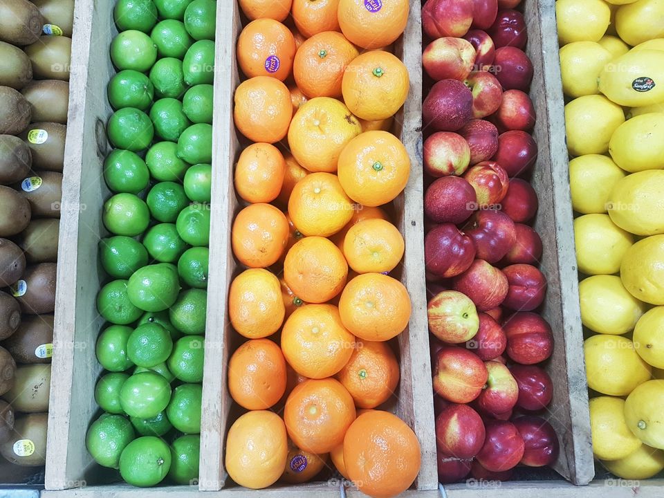 Fresh Fruit and Vegetables at market stall colours pattern citrus