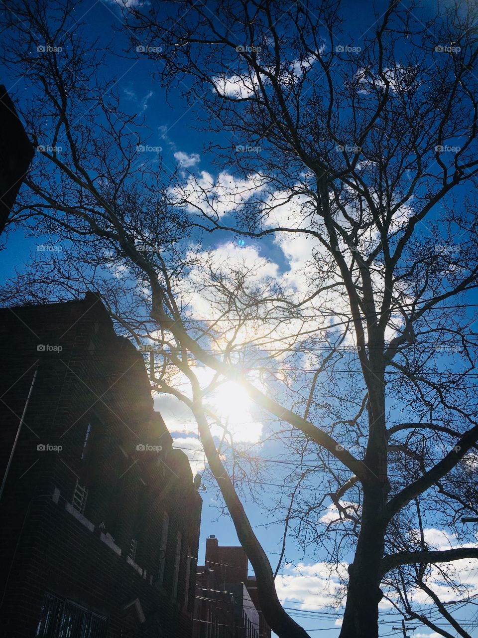 Sun peeking threw the clouds in Brooklyn nyc 