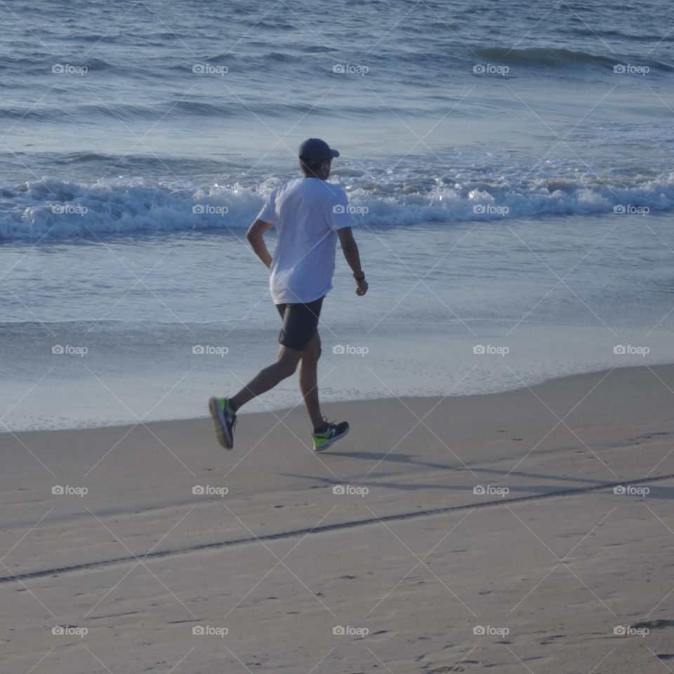 man running on the beach