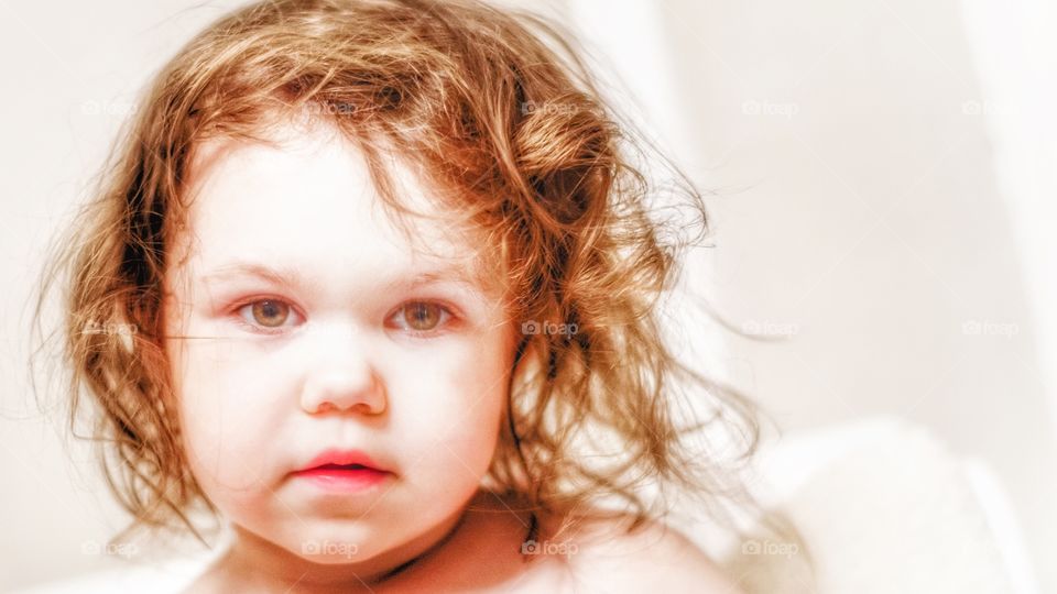 Close-up of baby girl with redhead