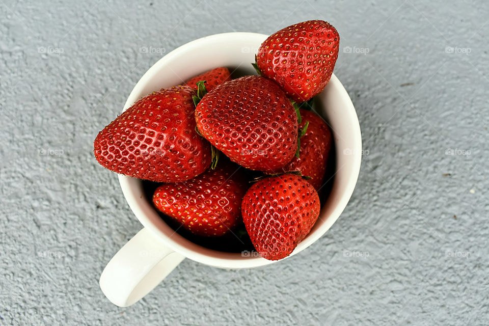 Cup Full Of Fresh Ripe Strawberries Isolated On Light Grey Background