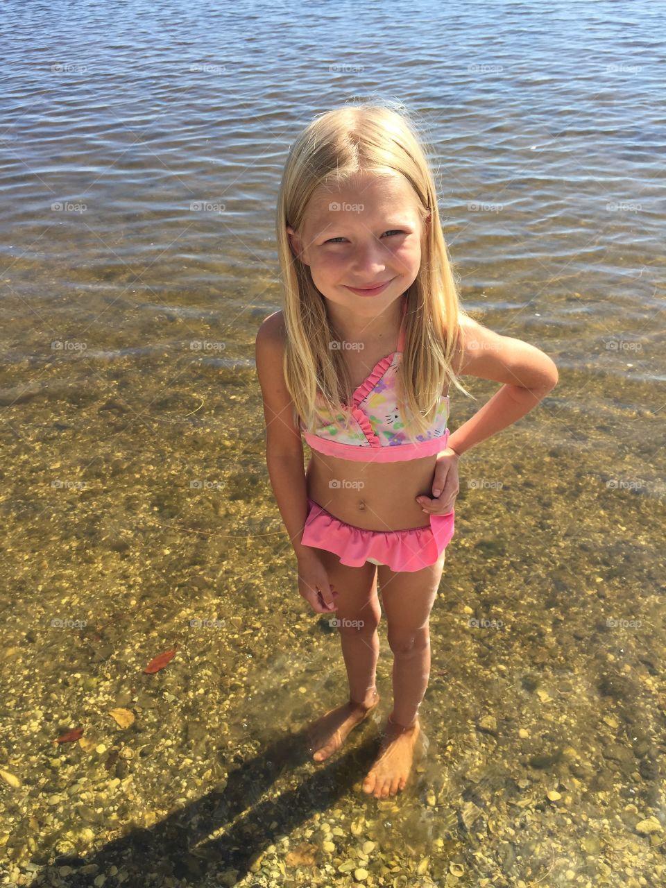 Little girl in river water 