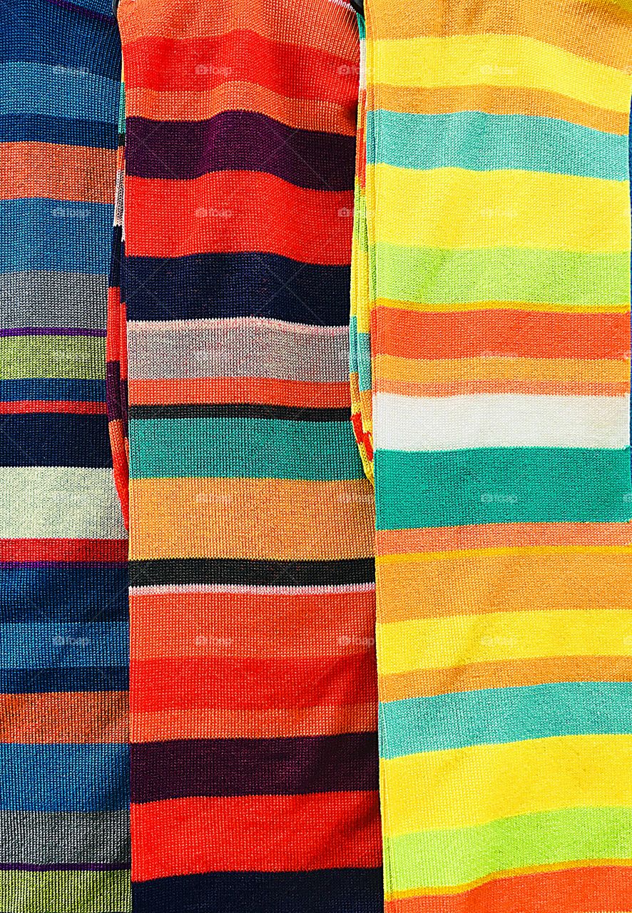 Color Love - a vertical photo of colorful material exposing their multicolors in a horizontal pattern