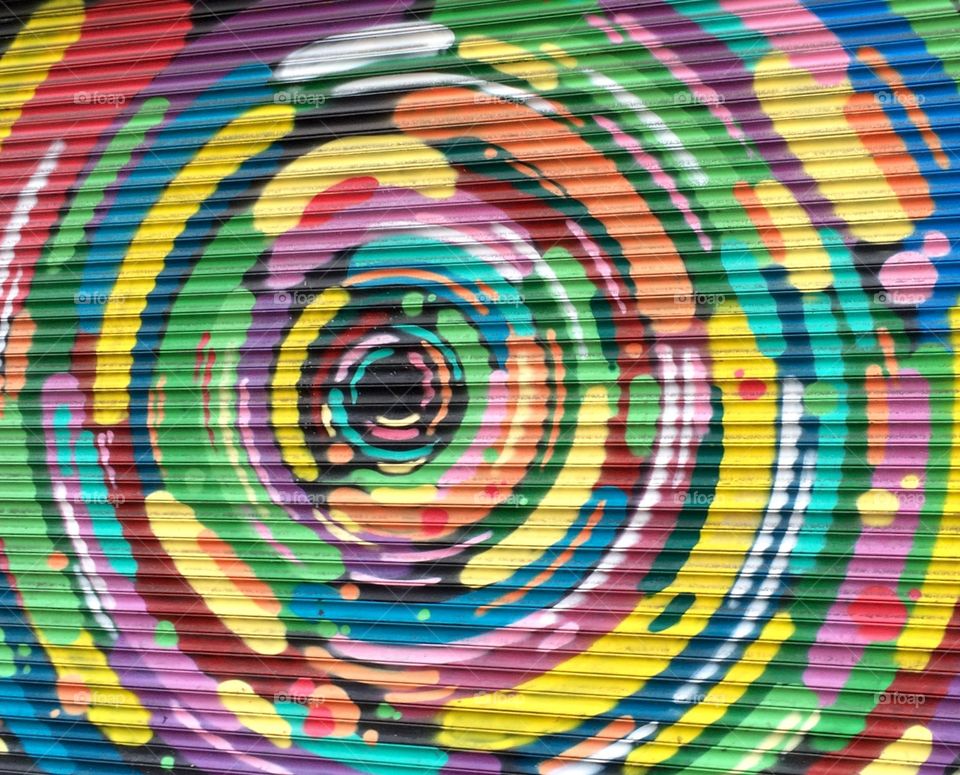 Garage Bling ... sharing with you my fellow foapers ... a photo I took in Dublin early in the morning whilst searching for a shop to buy some milk for breakfast ... beautiful colourful spiral on a garage door ๐