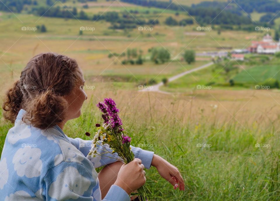 Happy with flowers in hand