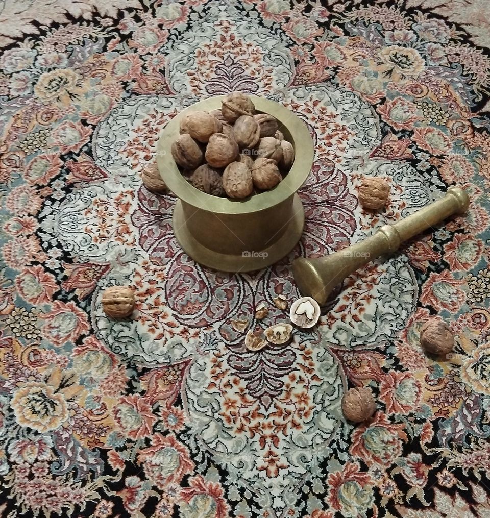 Mortar or Hwang is a navan or hole dug in the heart of wood or stone or a stone or metal container (usually brass) in which spices, plant seeds, etc. are pounded or ground with handles