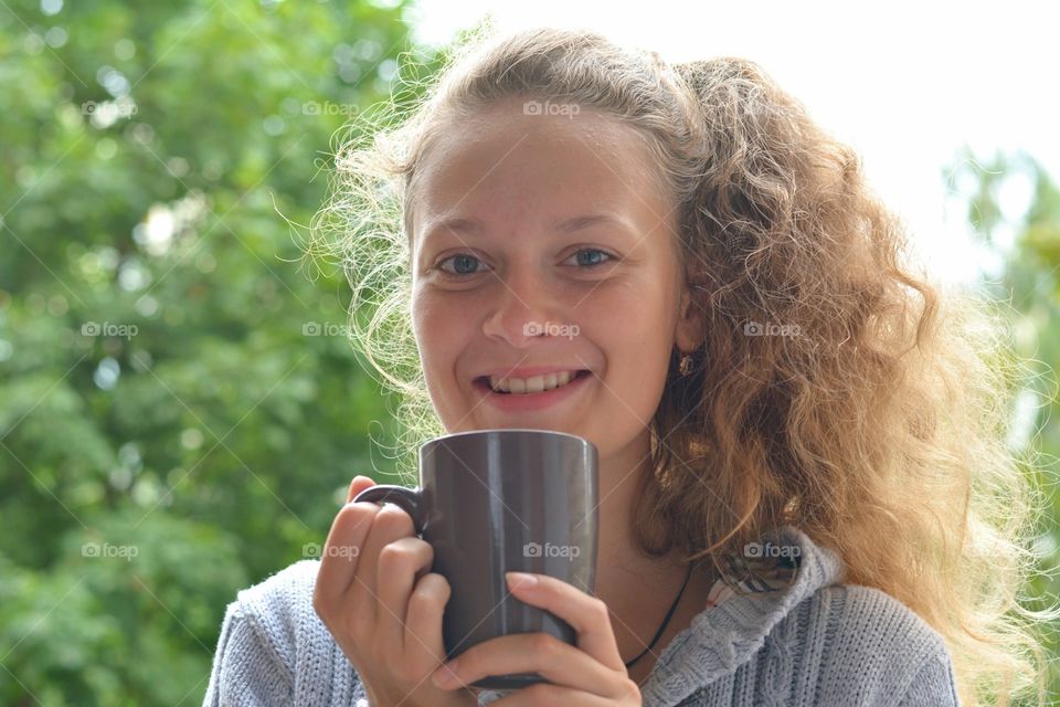 young girl with cup smiling beautiful portrait