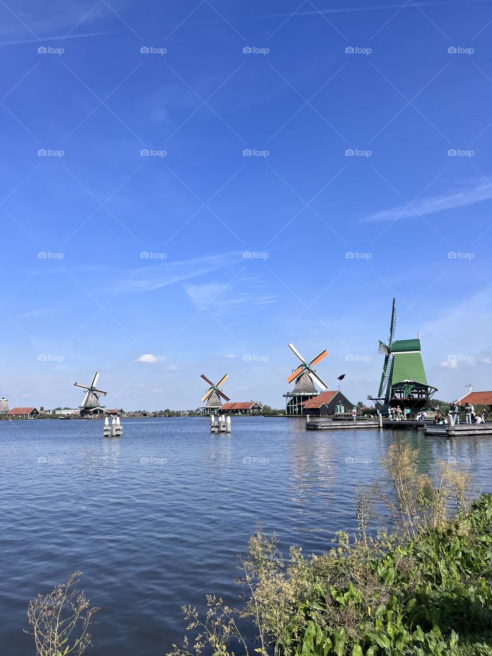 Colorful Dutch windmills on a lake