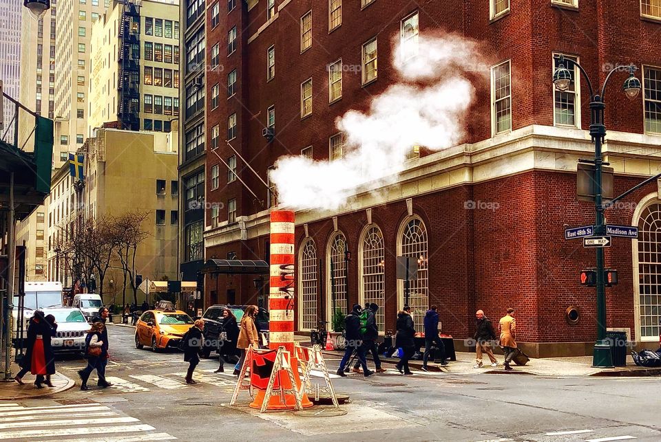 Smoke billows as New Yorker’s rush to work on a busy morning in the city! 