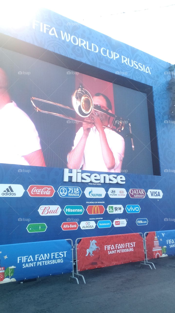 Big monitor in fan zone. Concert before football.