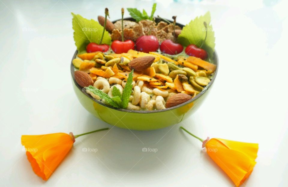 Fresh Fruit Smoothie Bowl - cheery,  mango, banana, cereals,  seeds and nuts