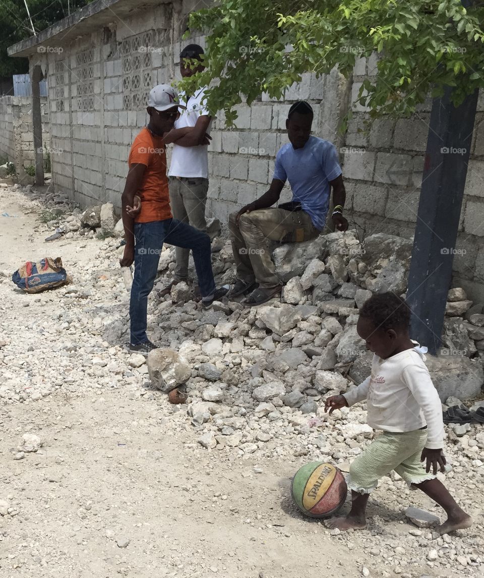 Haitian boys playing kickball in Grand Goâve