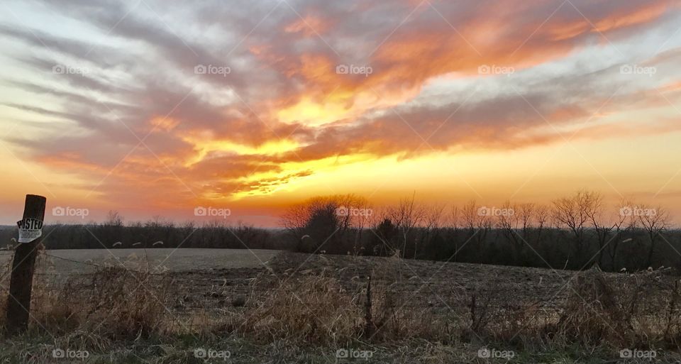 Scenic view of landscape against dramatic sky