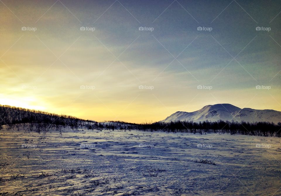Sunset in winter landscape 