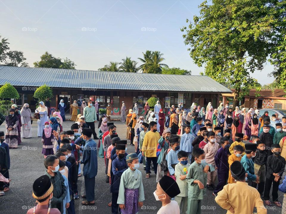 Children wearing traditional clothing at school to celebrate Hari Raya