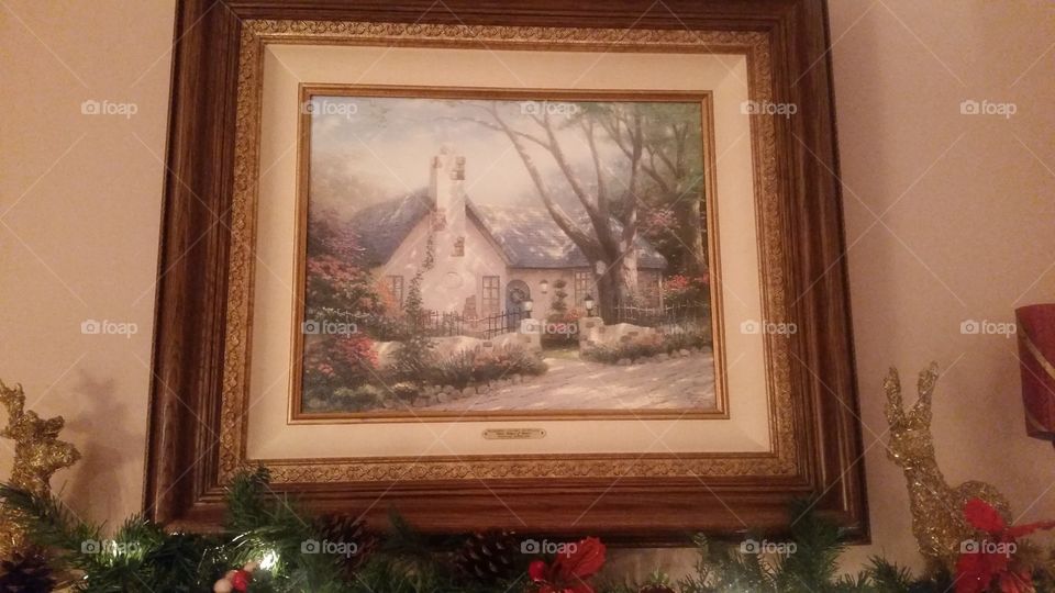 Picture of a building on a wall.