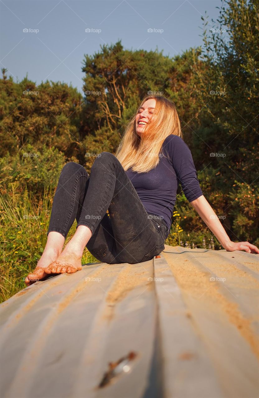 Beautiful young happy girl smiling and enjoying nature and life