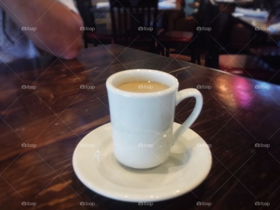 Coffee with Cream Sitting on a Table