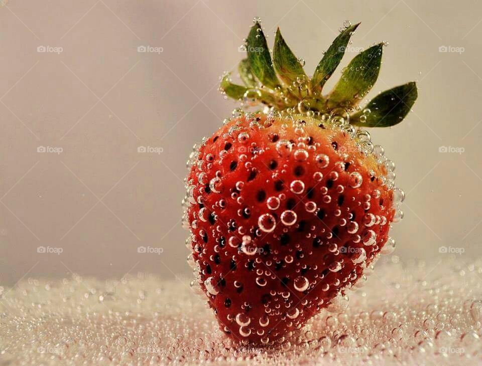 Close-up of red strawberry in water