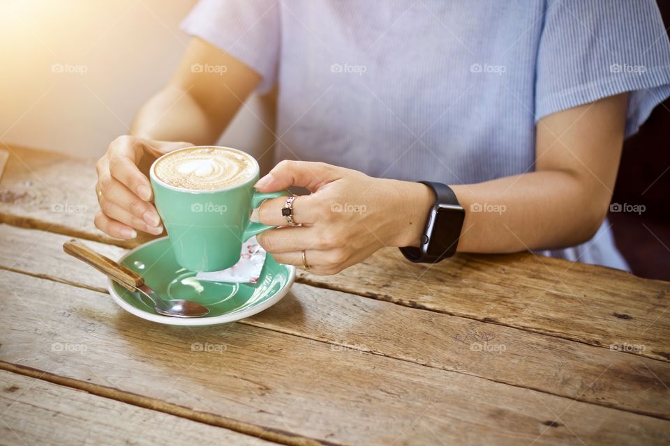 Women drinking coffee cup 