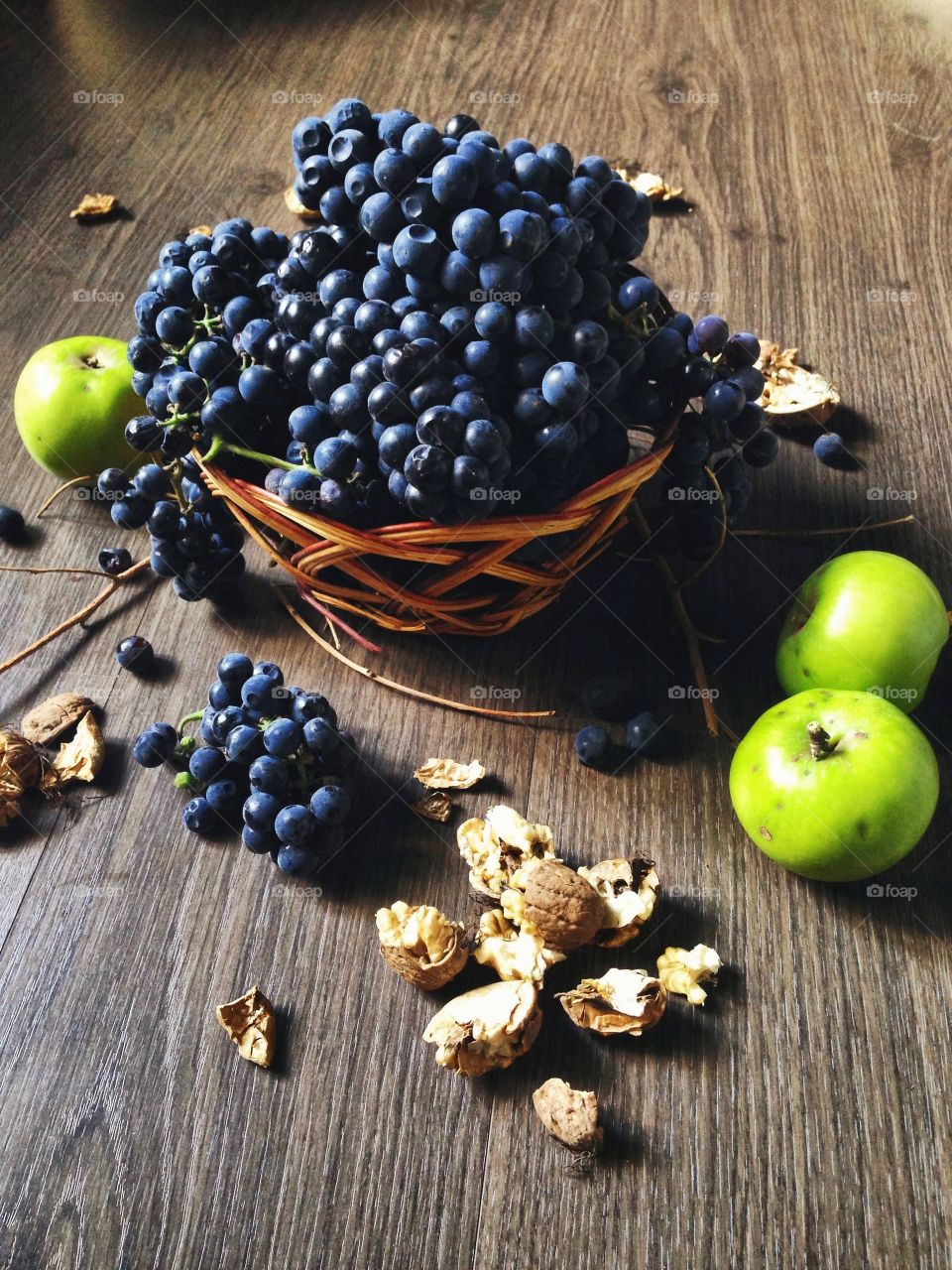 Some yummy 'things'. Grapes, apples and nuts on the floor 